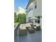 A lovely outdoor seating area with modern patio furniture and an umbrella for shade on the deck at 6355 Westfallen Overlook, Cumming, GA 30040