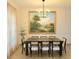 Elegant dining room featuring a large table, stylish chairs, and a statement art piece at 6355 Westfallen Overlook, Cumming, GA 30040