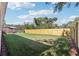 A wide backyard featuring new fencing and lush green grass at 7540 Conyers St, Lithonia, GA 30058