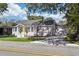 Charming single-story home with yellow front door and well-manicured lawn at 7540 Conyers St, Lithonia, GA 30058