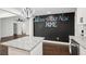 Open-concept kitchen with granite countertops and an inviting chalkboard wall at 7540 Conyers St, Lithonia, GA 30058