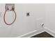Clean, white laundry room with plumbing for washing machine ready to be hooked up at 7540 Conyers St, Lithonia, GA 30058