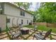 Spacious backyard with patio, fire pit, and lush greenery, perfect for outdoor entertaining and relaxation at 82 Dearborn Se St, Atlanta, GA 30317