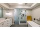 Modern bathroom with double vanity and a glass-enclosed shower with marble tile at 82 Dearborn Se St, Atlanta, GA 30317
