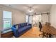 Bright bedroom features a blue sofa and a workspace with natural light at 82 Dearborn Se St, Atlanta, GA 30317