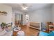 Bright Bedroom with a crib, cozy seating, mirrored closet doors, and warm hardwood floors, creating a comforting and stylish space at 82 Dearborn Se St, Atlanta, GA 30317