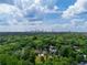 Breathtaking aerial view showcases the city skyline beyond a lush canopy of trees at 82 Dearborn Se St, Atlanta, GA 30317
