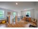 Upstairs hallway with wooden floors and a view of the staircase and a desk area at 82 Dearborn Se St, Atlanta, GA 30317