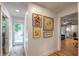 Bright hallway featuring artwork and a door leading to the outside at 82 Dearborn Se St, Atlanta, GA 30317