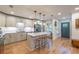 Bright kitchen with white cabinets, stainless steel appliances, and an eat-in island at 82 Dearborn Se St, Atlanta, GA 30317