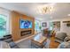 Comfortable living room with a fireplace and wood accent wall, seamlessly connecting to the dining area at 82 Dearborn Se St, Atlanta, GA 30317
