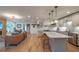 Open concept living room flows into a kitchen with a marble island and stainless steel appliances at 82 Dearborn Se St, Atlanta, GA 30317