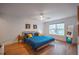 Serene main bedroom with wood floors, large window, and comfortable bed at 82 Dearborn Se St, Atlanta, GA 30317