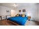 Bright main bedroom with wood floors and a comfortable bed with yellow pillows at 82 Dearborn Se St, Atlanta, GA 30317