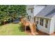 Backyard of home featuring a deck, playset, and trampoline at 102 Woodsfield Ln, Hiram, GA 30141