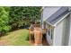 Backyard featuring a deck with stairs, a trampoline, and a play set at 102 Woodsfield Ln, Hiram, GA 30141