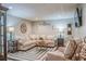 Basement living room featuring a sectional sofa, area rug, and decorative accents at 102 Woodsfield Ln, Hiram, GA 30141