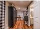 Hallway with a black cabinet and access to a full bathroom and dining area at 102 Woodsfield Ln, Hiram, GA 30141