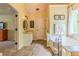 Bathroom showcasing a tile floor, soaking tub, vanity, and an open doorway to a bedroom at 102 Woodsfield Ln, Hiram, GA 30141