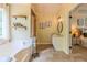 Bathroom featuring tile flooring, neutral walls, floating shelves, and an open doorway to an adjacent bedroom at 102 Woodsfield Ln, Hiram, GA 30141