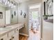 Bathroom featuring a sink, vanity, wood-look floors, and a view of the toilet through the hallway at 102 Woodsfield Ln, Hiram, GA 30141