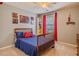 Vibrant bedroom with a playful theme, comfortable bed, and a window with natural light at 102 Woodsfield Ln, Hiram, GA 30141