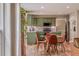 Open concept dining area features green cabinets and stainless steel appliances at 102 Woodsfield Ln, Hiram, GA 30141