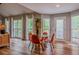 Bright dining area featuring hardwood floors, multiple windows and natural light at 102 Woodsfield Ln, Hiram, GA 30141