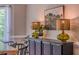 Close-up of the dining room featuring unique lamps, neutral color palette, and greenery at 102 Woodsfield Ln, Hiram, GA 30141
