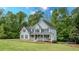 Beautiful two-story home with a large front yard and classic architectural details at 102 Woodsfield Ln, Hiram, GA 30141