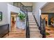Spacious foyer with hardwood floors, a staircase, and views into adjoining rooms at 102 Woodsfield Ln, Hiram, GA 30141