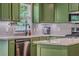 A beautiful kitchen with stainless appliances, tile backsplash, and tons of countertop space at 102 Woodsfield Ln, Hiram, GA 30141