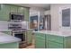 This home's kitchen includes stainless steel appliances, subway tile backsplash, and a kitchen island at 102 Woodsfield Ln, Hiram, GA 30141