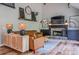 Spacious living room with fireplace, modern decor, and hardwood floors at 102 Woodsfield Ln, Hiram, GA 30141
