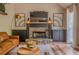 Charming living room features stone fireplace, hardwood floors, and comfortable seating at 102 Woodsfield Ln, Hiram, GA 30141