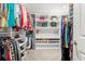 Walk-in closet with ample shelving and hanging space for clothing and accessories at 1700 Prospect Way, Conyers, GA 30094