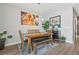 Elegant dining room featuring modern art, stylish furniture, and a cozy ambiance at 1700 Prospect Way, Conyers, GA 30094