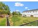 Community dog park surrounded by black fencing, green grass, and a cozy bench at 1700 Prospect Way, Conyers, GA 30094