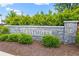 Stone community sign for Eastmoore, set amidst manicured landscaping, welcoming residents and visitors at 1700 Prospect Way, Conyers, GA 30094