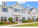 Inviting townhome exterior with gray siding, dormer windows, and professionally landscaped front yard at 1700 Prospect Way, Conyers, GA 30094