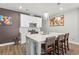 Modern kitchen with stainless steel appliances, white cabinetry, and a spacious island with seating at 1700 Prospect Way, Conyers, GA 30094