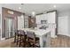 Well-equipped kitchen featuring a large island, stainless steel appliances, and stylish lighting fixtures at 1700 Prospect Way, Conyers, GA 30094
