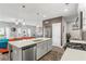Bright, open kitchen with stainless steel appliances and island, perfect for entertaining and Gathering gatherings at 1700 Prospect Way, Conyers, GA 30094