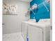 Functional laundry room with modern appliances and shelving for storage, making laundry tasks convenient and organized at 1700 Prospect Way, Conyers, GA 30094