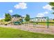 Community playground with swings and slides, perfect for Gathering fun near attractive white homes at 1700 Prospect Way, Conyers, GA 30094