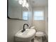 Bathroom featuring modern fixtures, vanity, and a framed mirror at 2137 Delowe Dr, Atlanta, GA 30344