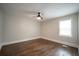 Bedroom featuring hardwood floors, neutral paint, and a ceiling fan at 2137 Delowe Dr, Atlanta, GA 30344