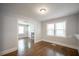 Bright dining area with hardwood floors, a passthrough to the kitchen, and lots of natural light at 2137 Delowe Dr, Atlanta, GA 30344