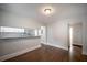 Dining area with hardwood floors and a passthrough to the kitchen featuring granite countertops at 2137 Delowe Dr, Atlanta, GA 30344