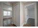 Hallway with an open doorway and a closet with double doors at 2137 Delowe Dr, Atlanta, GA 30344